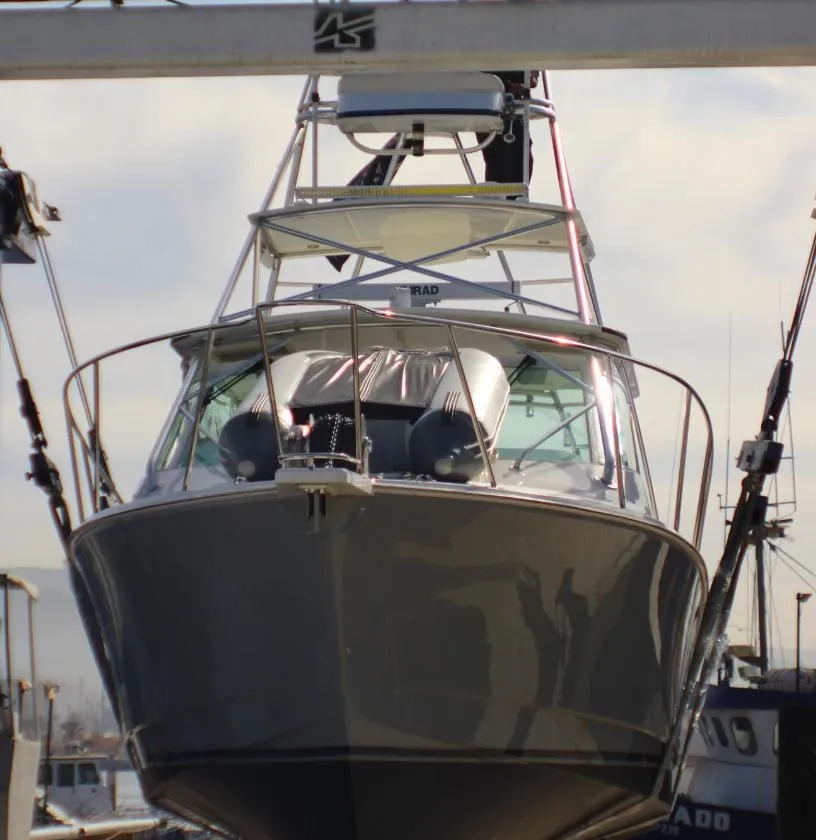 Sportfisher suspended in travel lift, bow view